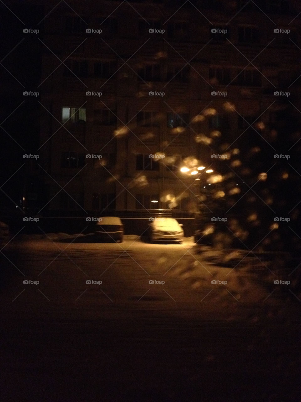 Car on parking in the winter night