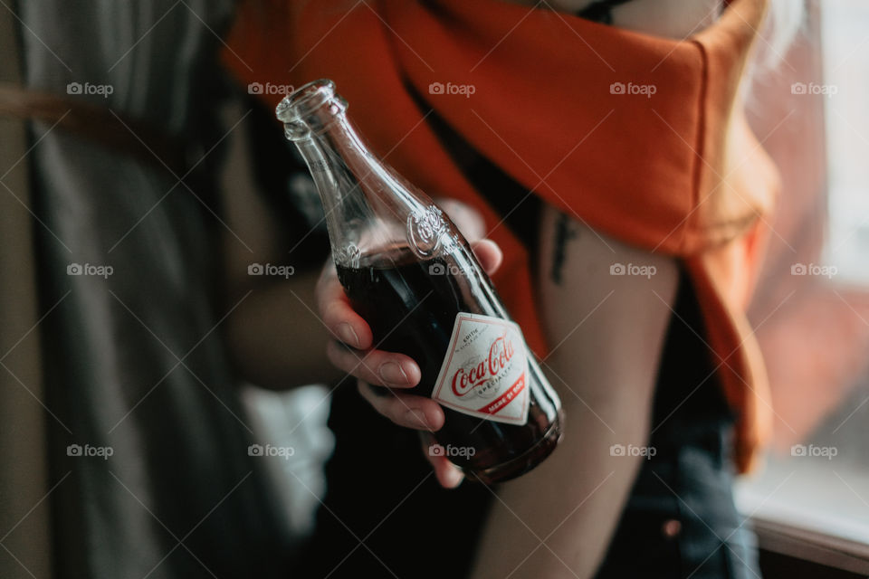 blond girl chilling with coca cola