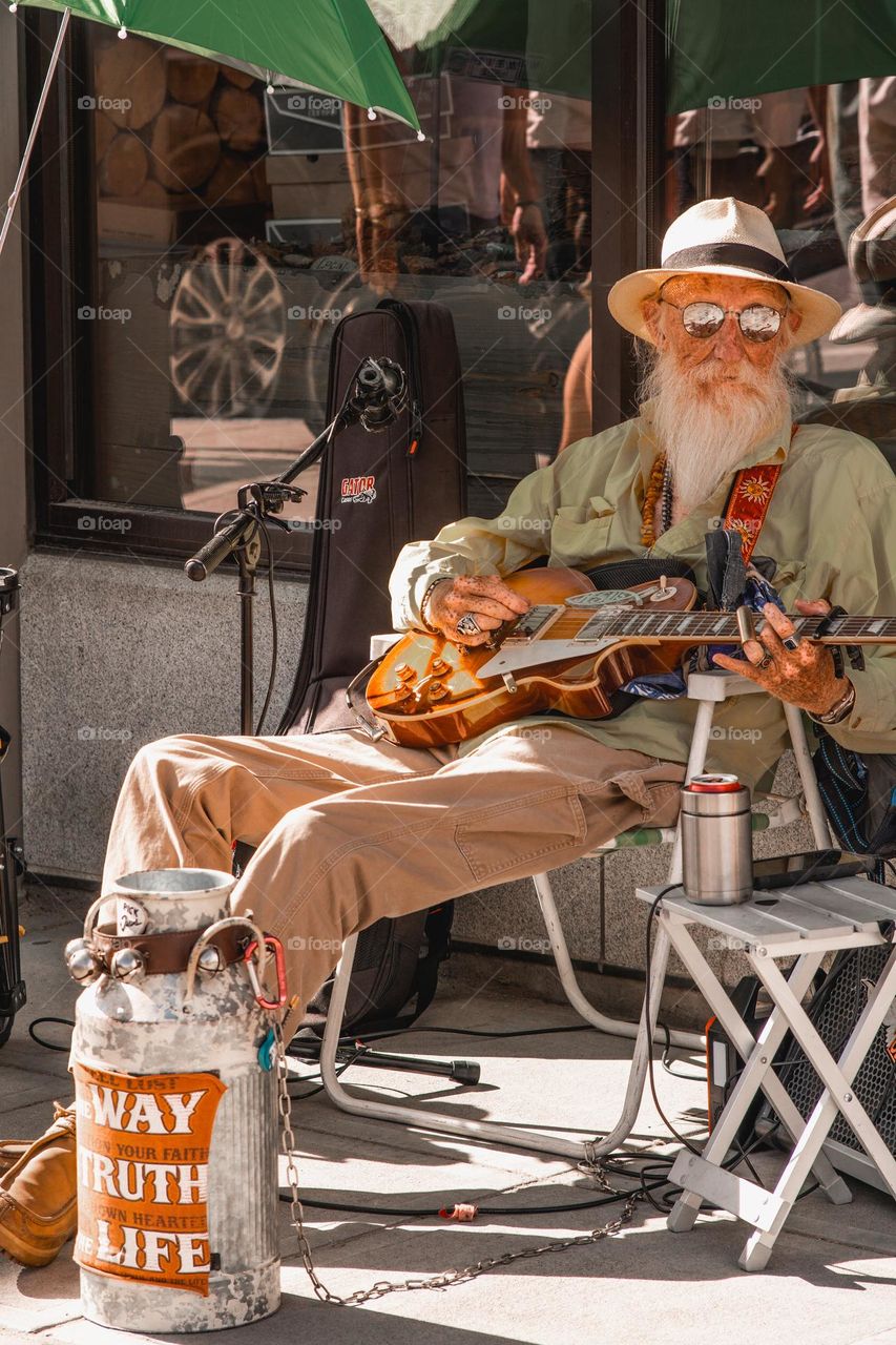 Old fellow making beautiful music.