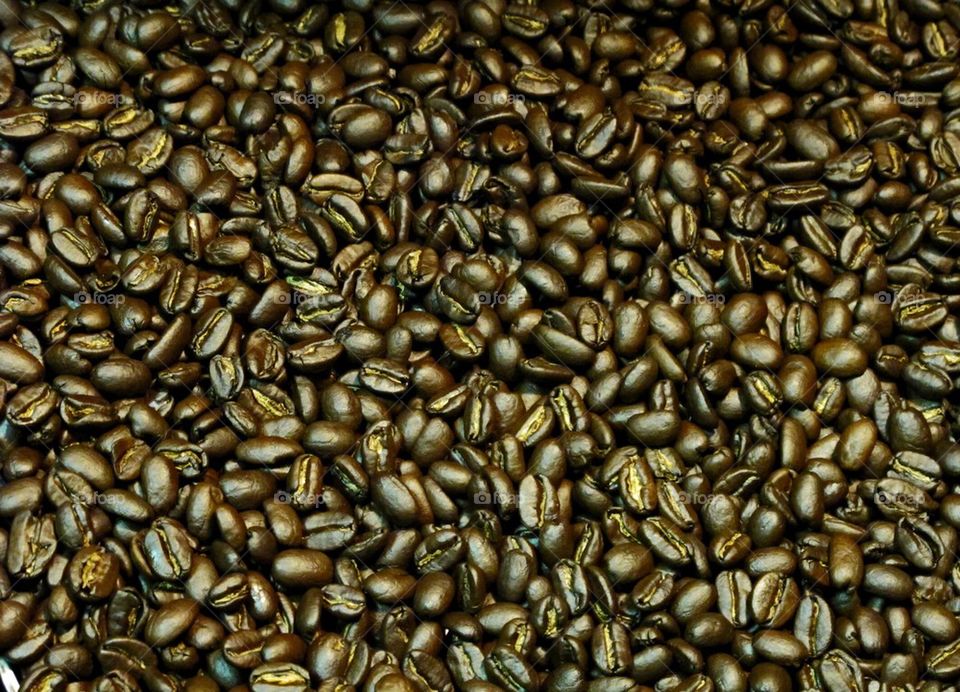 Freshly roasted coffee beans ready to be ground for a savory cup of coffee. 