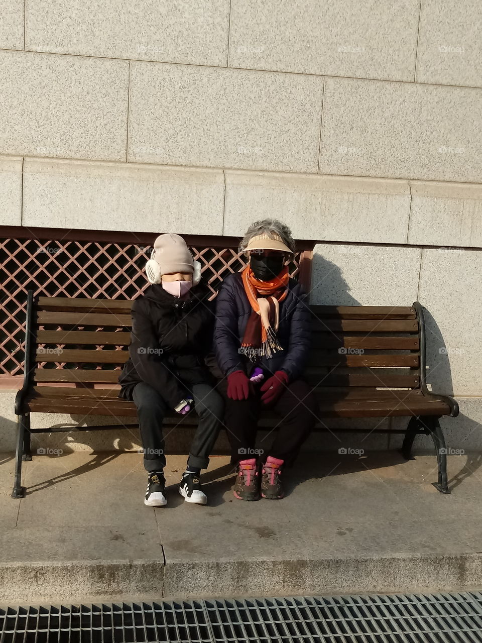 family are resting after a long walk. here is the place where you can sit , eat  or drink.