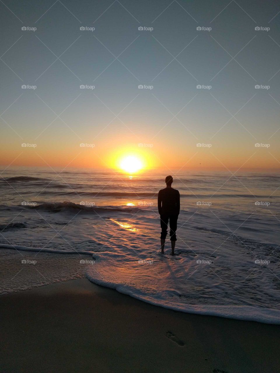 Man on a sunrise Beach