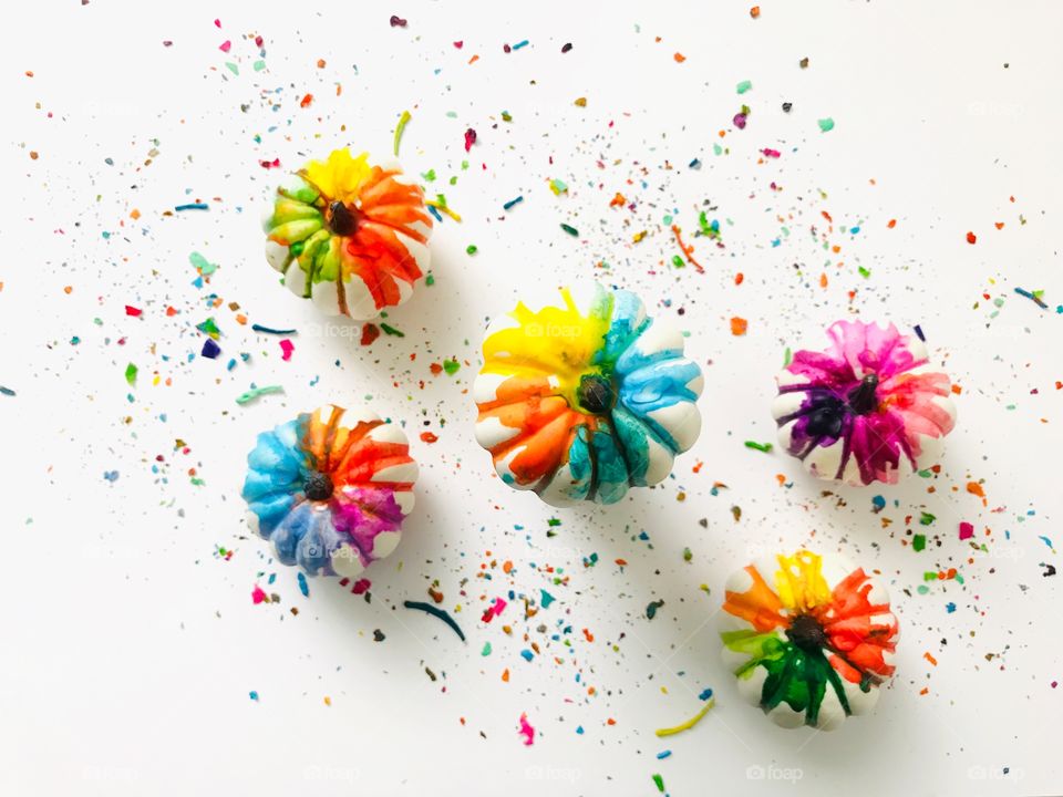 Melted crayons on white pumpkins