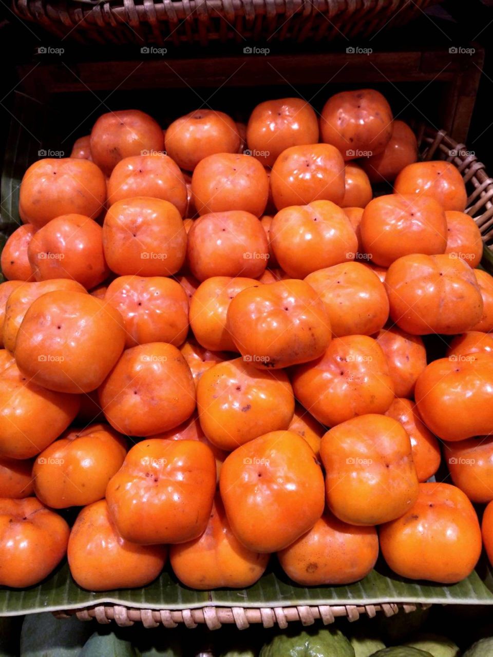 Persimmons for sale in supermarket.