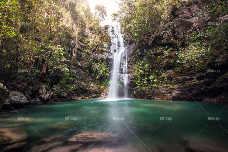 Waterfall and green lake