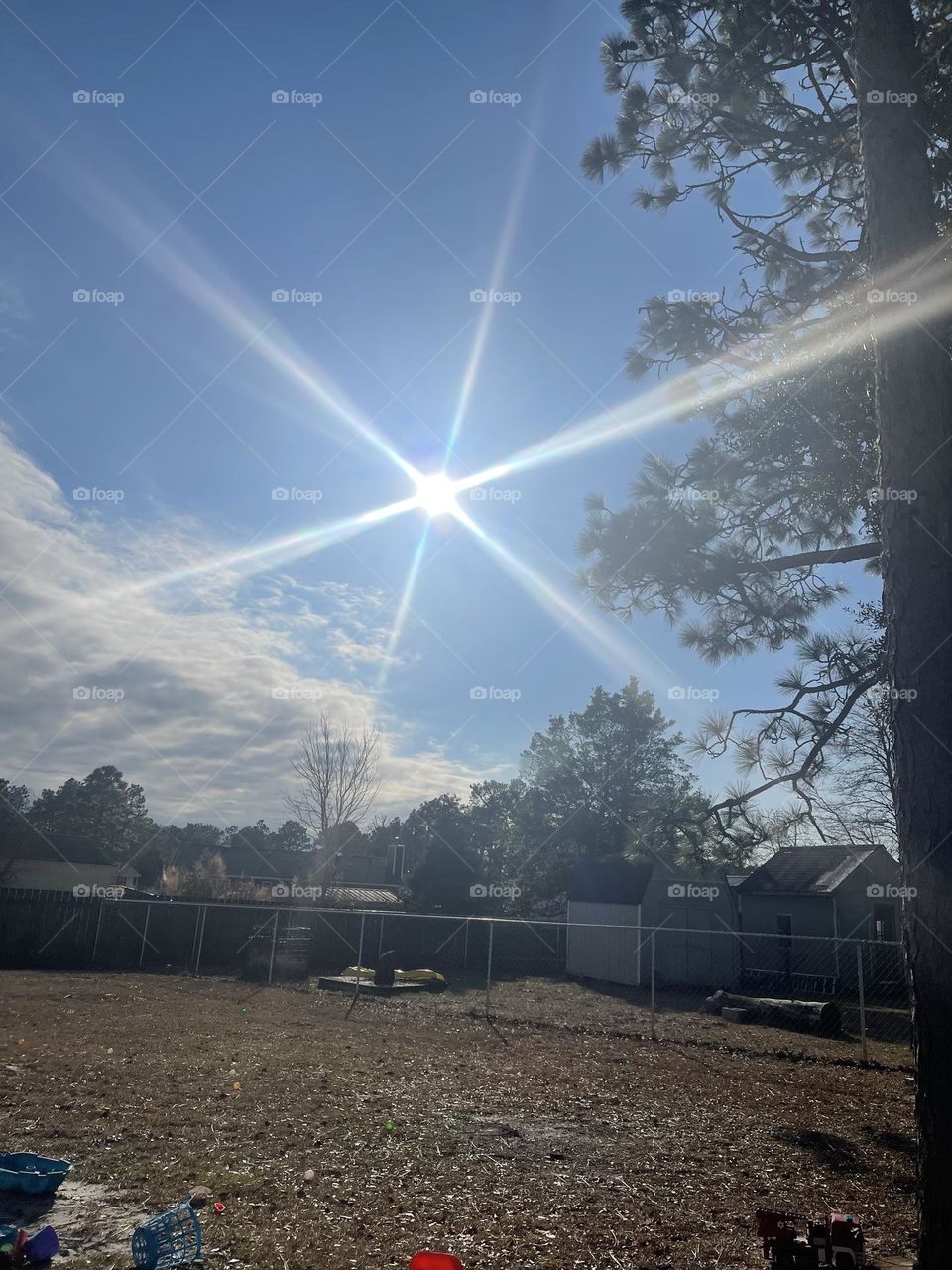 Beautiful Bright Sun shining blue skies with clouds. 