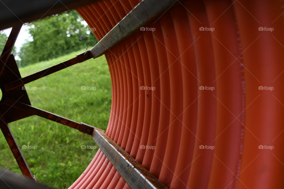 large reel of orange tubing