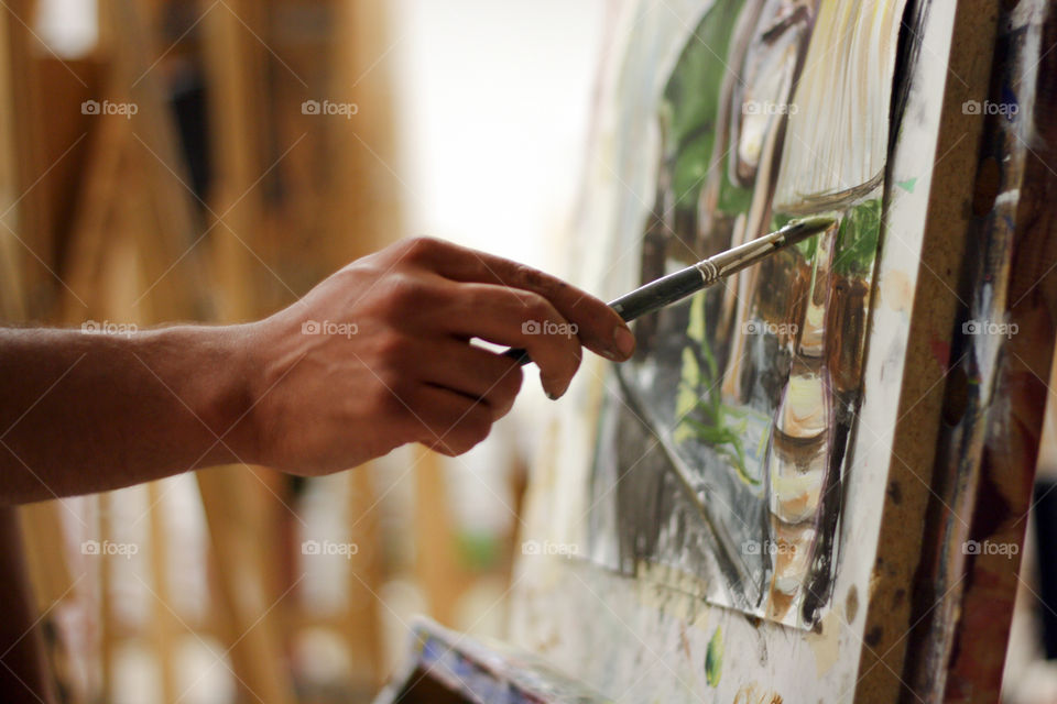An artist paints in the studio