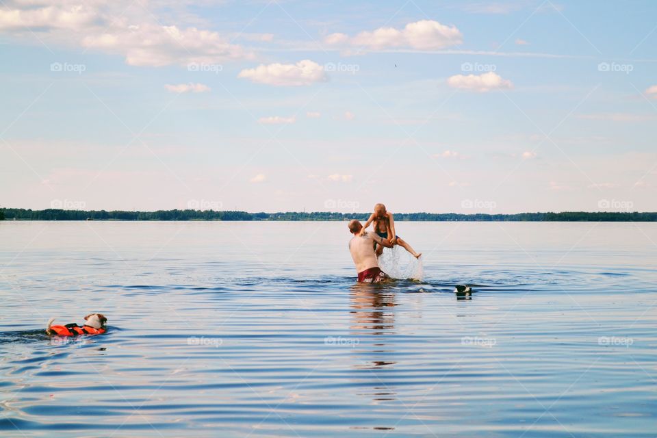 Family bathing in the lake