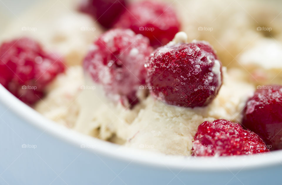 homemade ice cream with frozen cherry and raspberry.  summer and ice cream are perfect combination!
