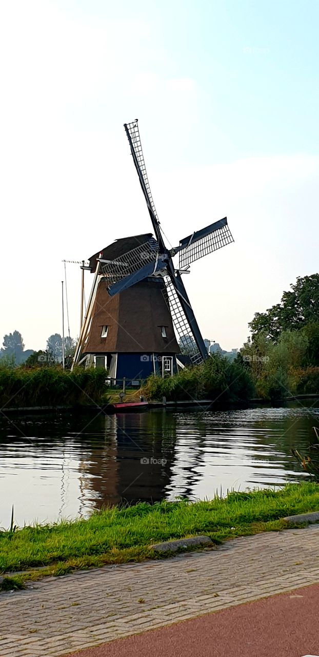 Dutch windmill at the waterside