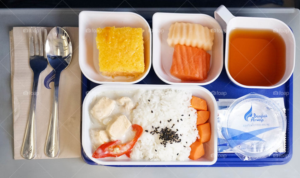 Krabi, Thailand - September 11, 2017 - Inflight meal service by Bangkok Airways, the boutique airline, Airbus A319 (flying from Krabi to Bangkok) Flight PG268, economy class.