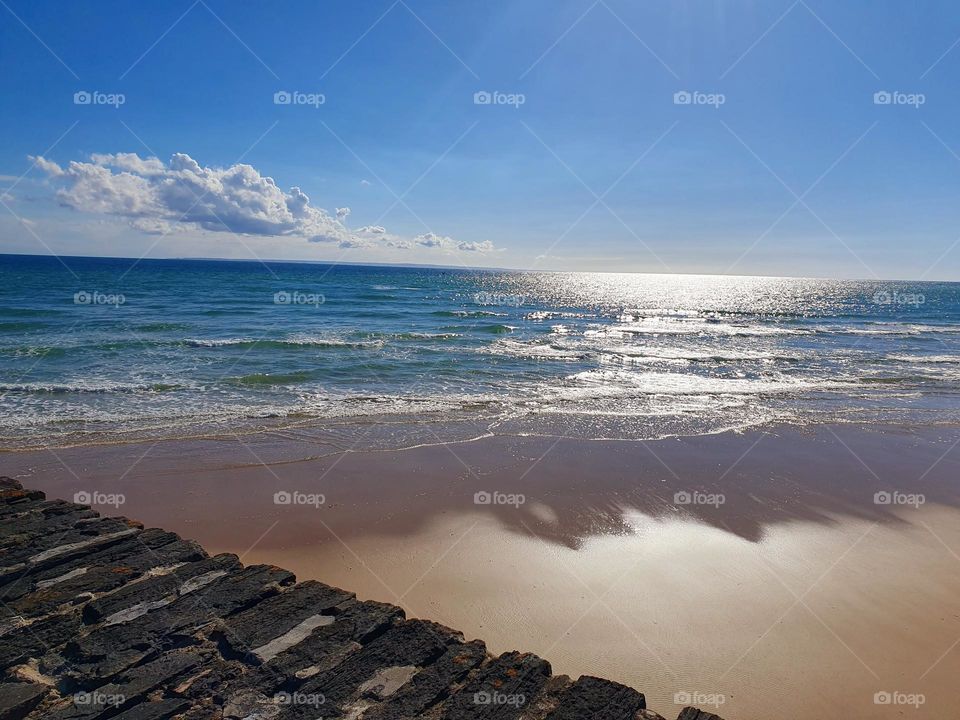 Luminescent sea waves on La Potinière beach