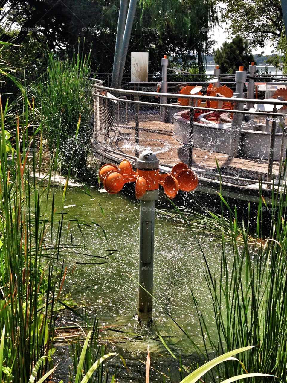 Sprinkle and spin. Water play area at an outdoor exhibit 