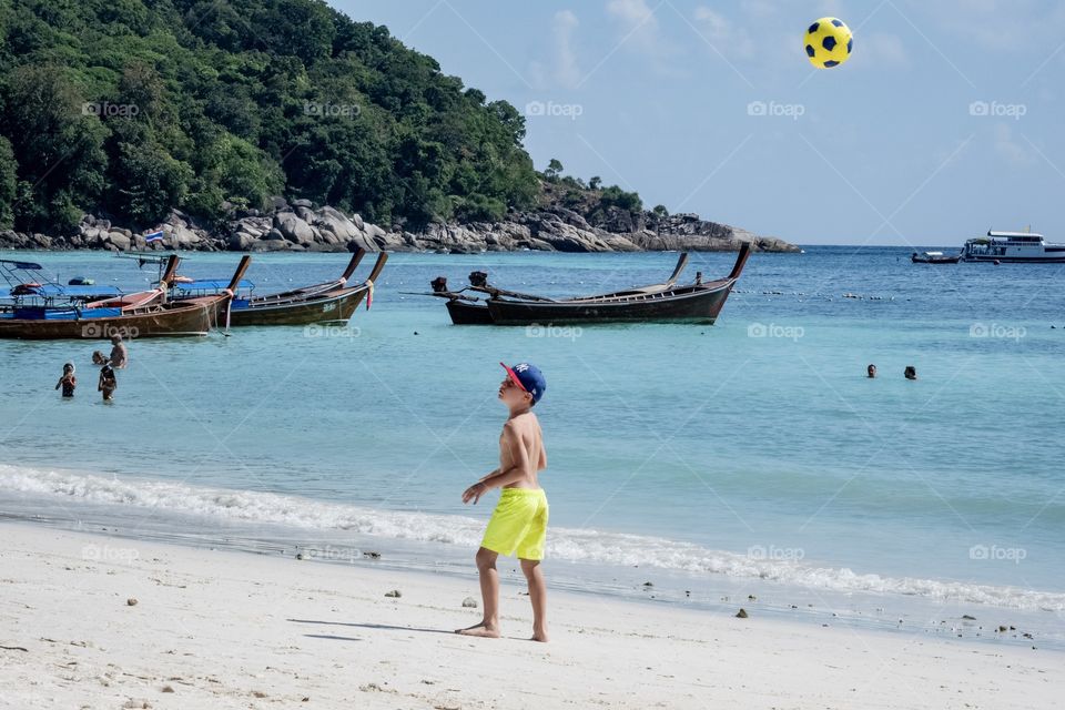 Soccer beach game make a boy so fun