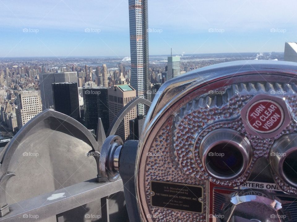 Seeing beyond the horizon . In the Top of the Rock, New York. 