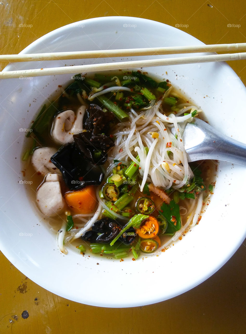 Vegetarian food . Hot and sour soup noodle Thai style. Fine cut white rice noodle.