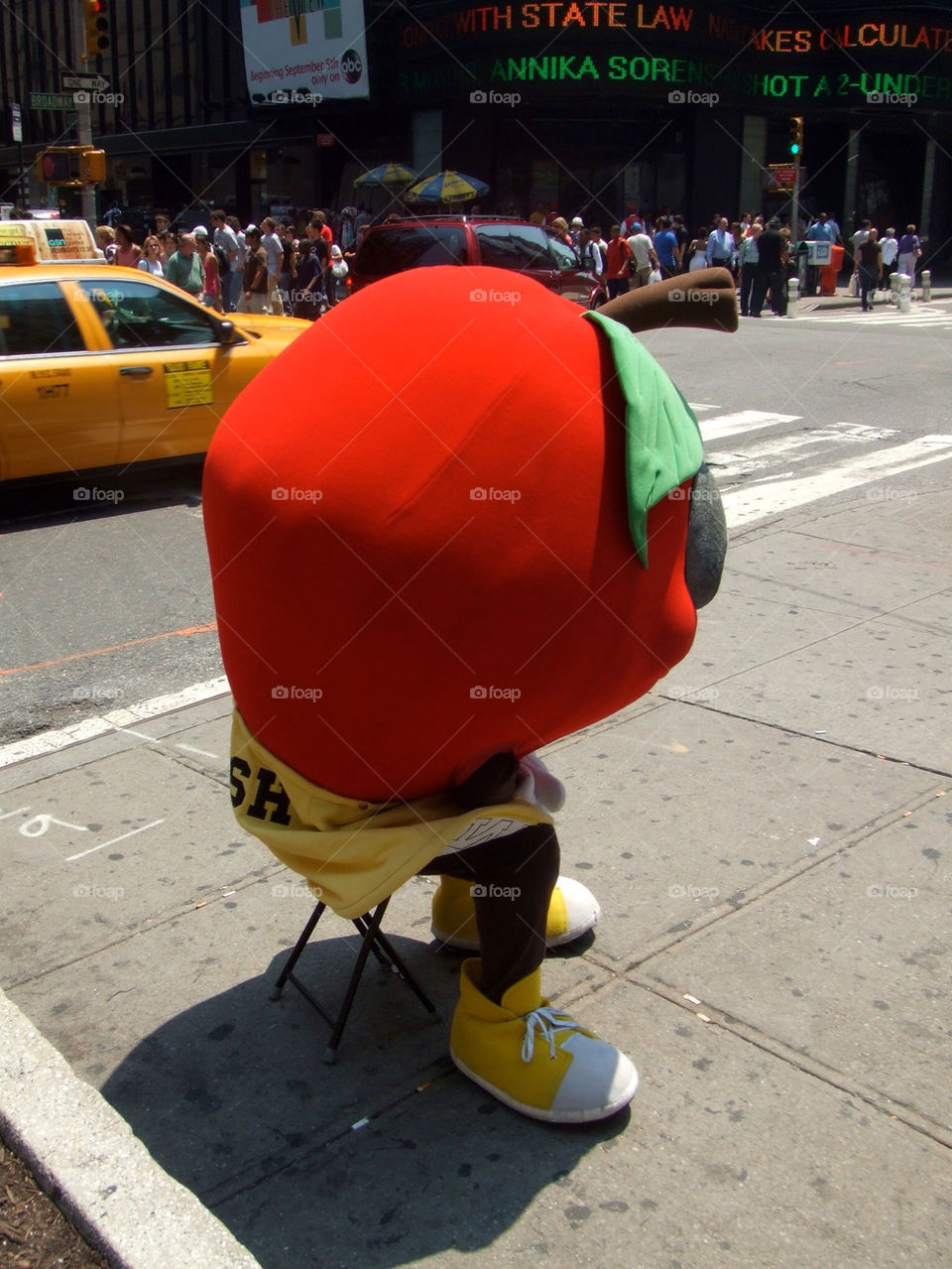 One very sad Apple. Middle of summer in Times Square in the boiling