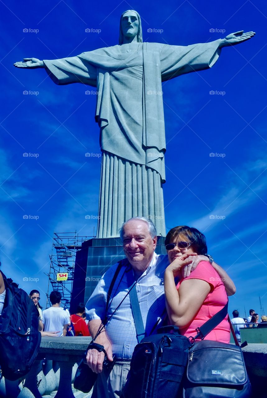 Senior posing at Rio de Janeiro with Christ Redeemer