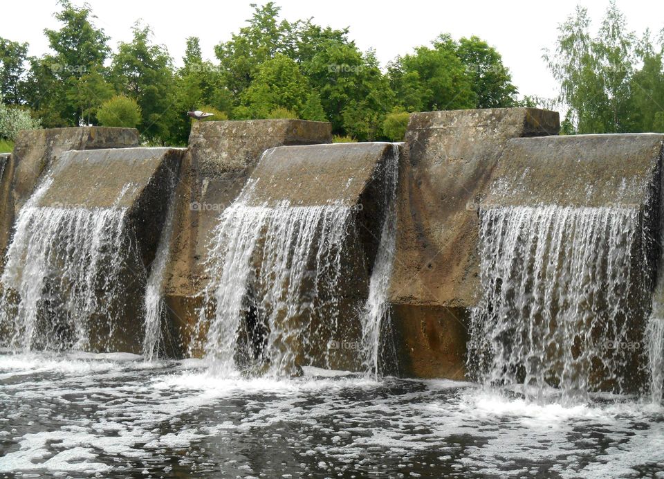 city waterfall stones wall