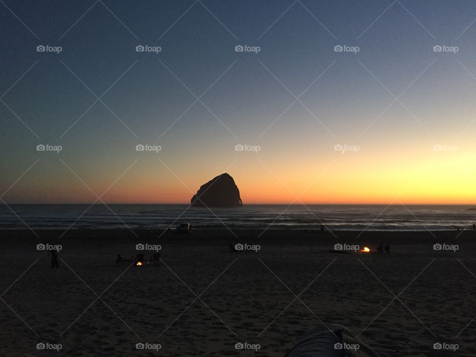 Sunset at Pacific City on the beach with bonfires 