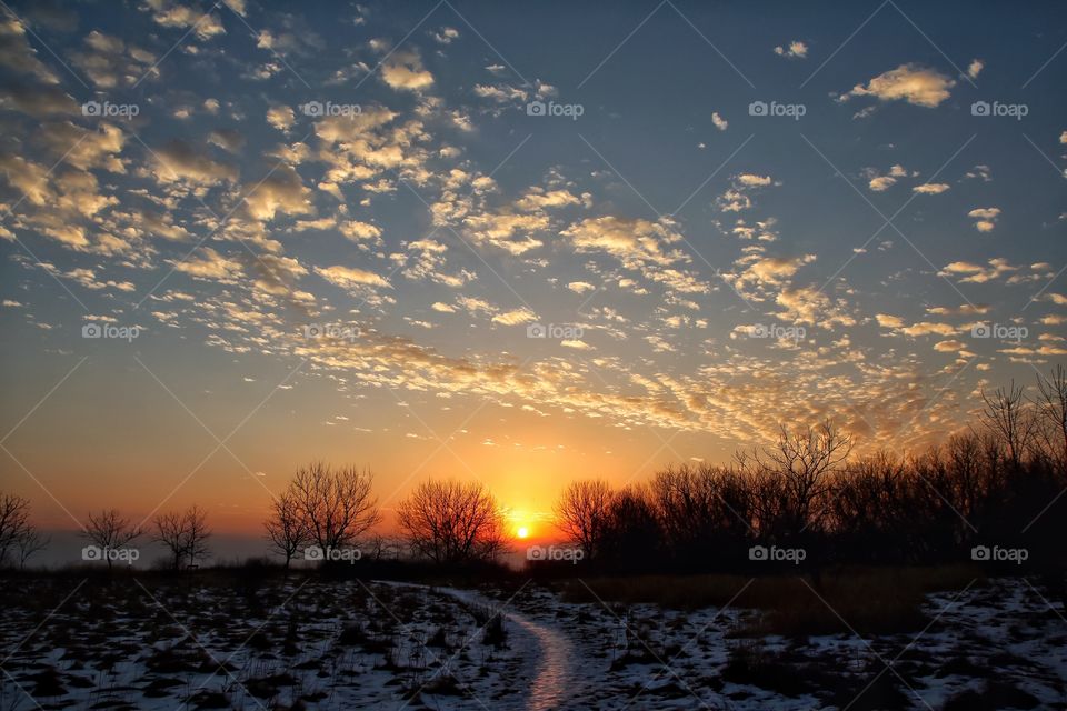 Snowy landscape against dramatic sky