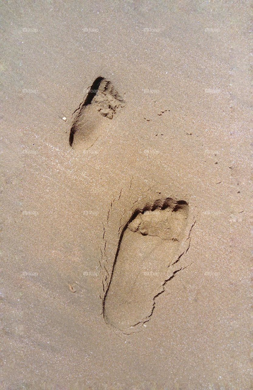 footprints on the beach