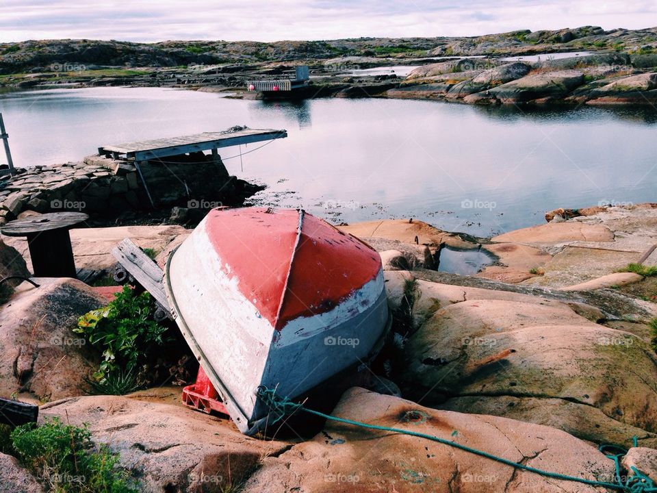 Boat on rock near the lake