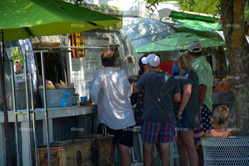 Street Food is ready to eat food or drink sold by a vendor or hawker, in street or other public place, such as a market or fair. I often buy Street Food from a portable food booth, food cart or a food truck! Yummy, yum!