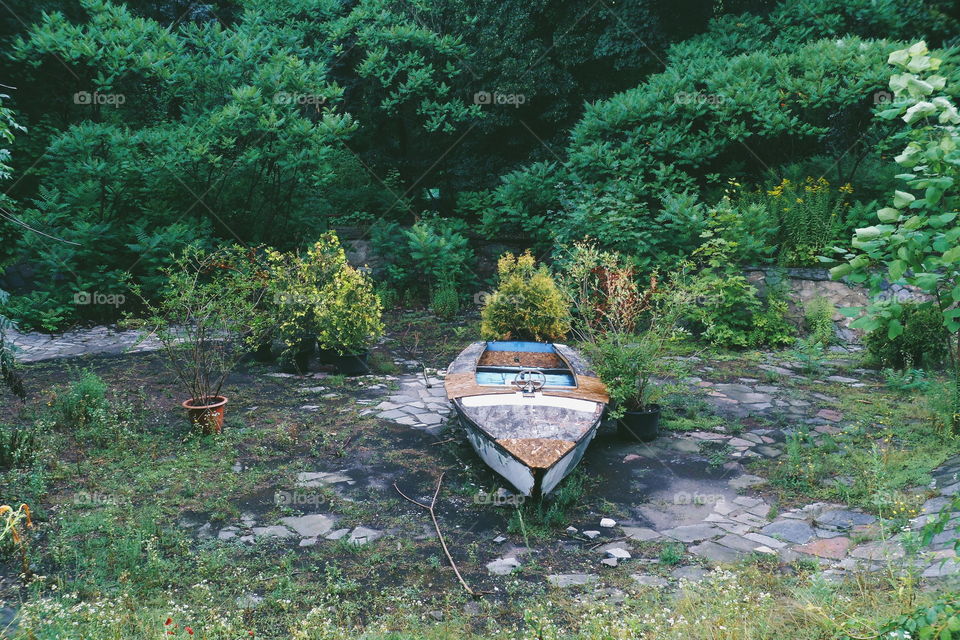 old boat in an abandoned pool