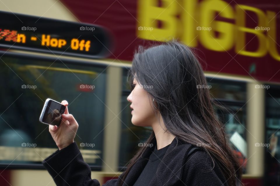 Girl is taking a photo with phone