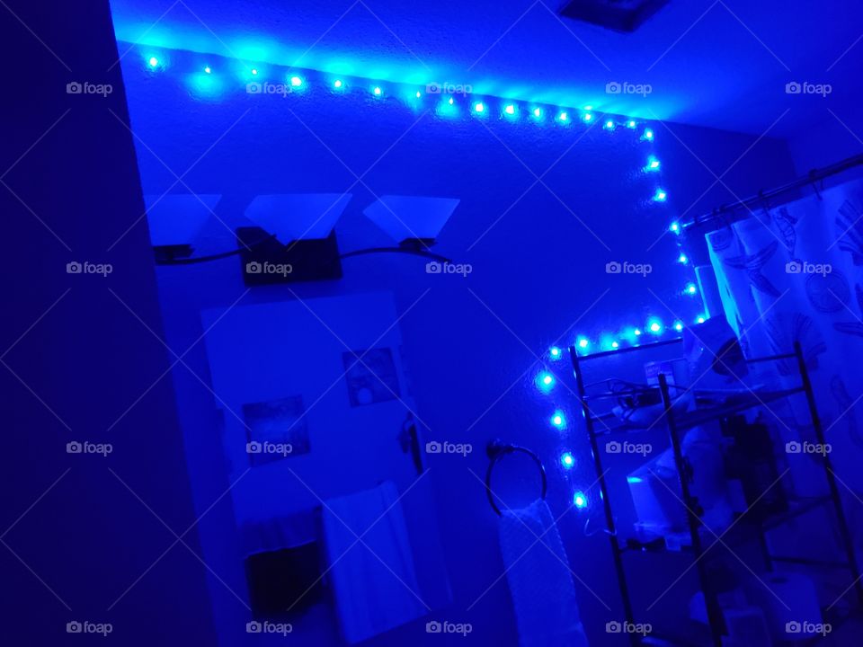 the new blue spring of lights actin as our night light in the bathroom