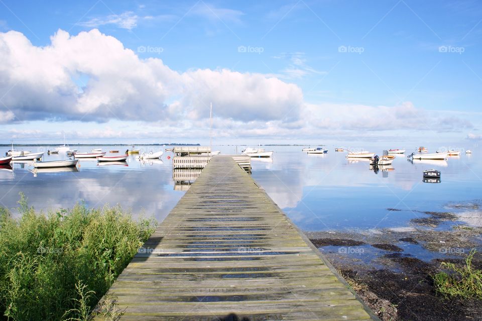 View of pier and boats at harbour