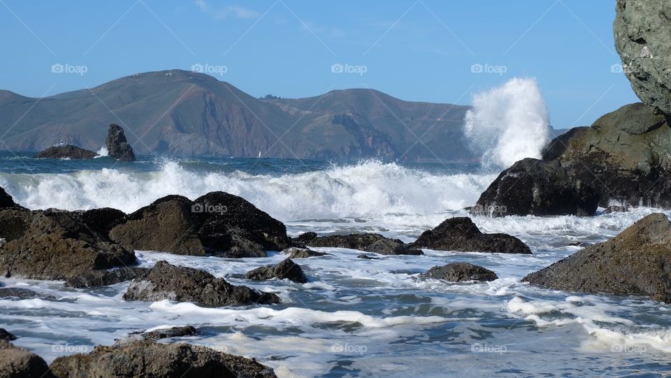 Mile Rock Beach. Rocky beach with waves crashing in San Francisco.