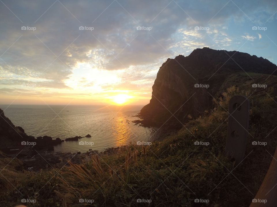 Scenic View Of Seongsan Ilchulbong against cloudy Sky