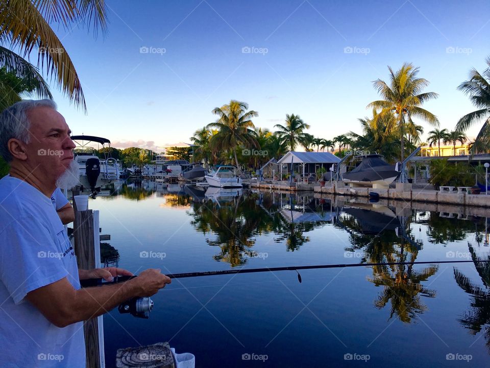 Senior man fishing in sea