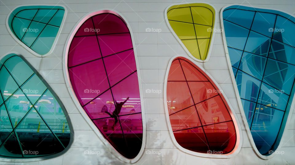 White wall with Colorful windows 