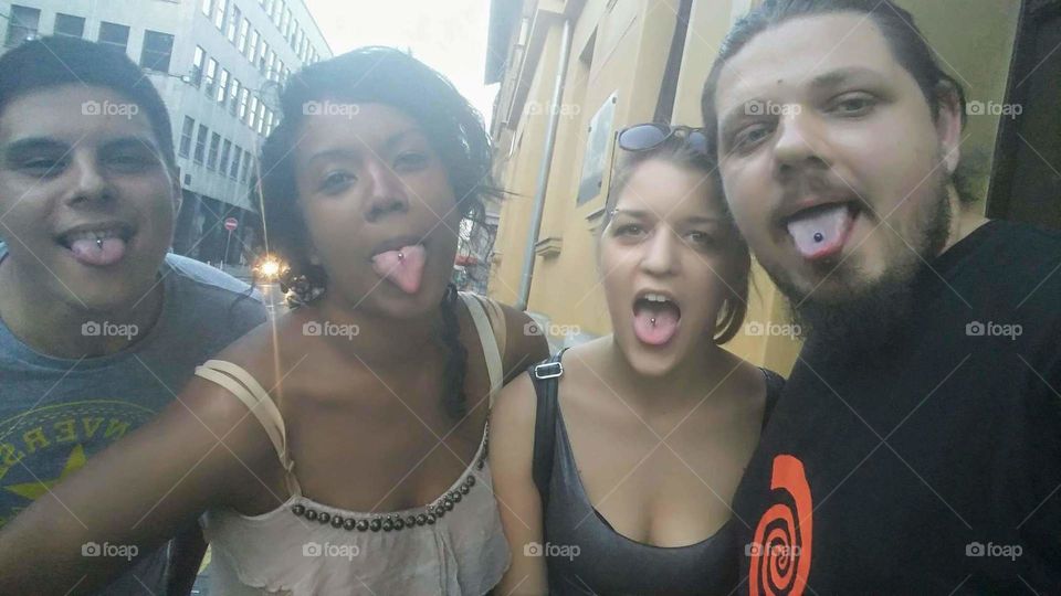 quartet of tongue piercings