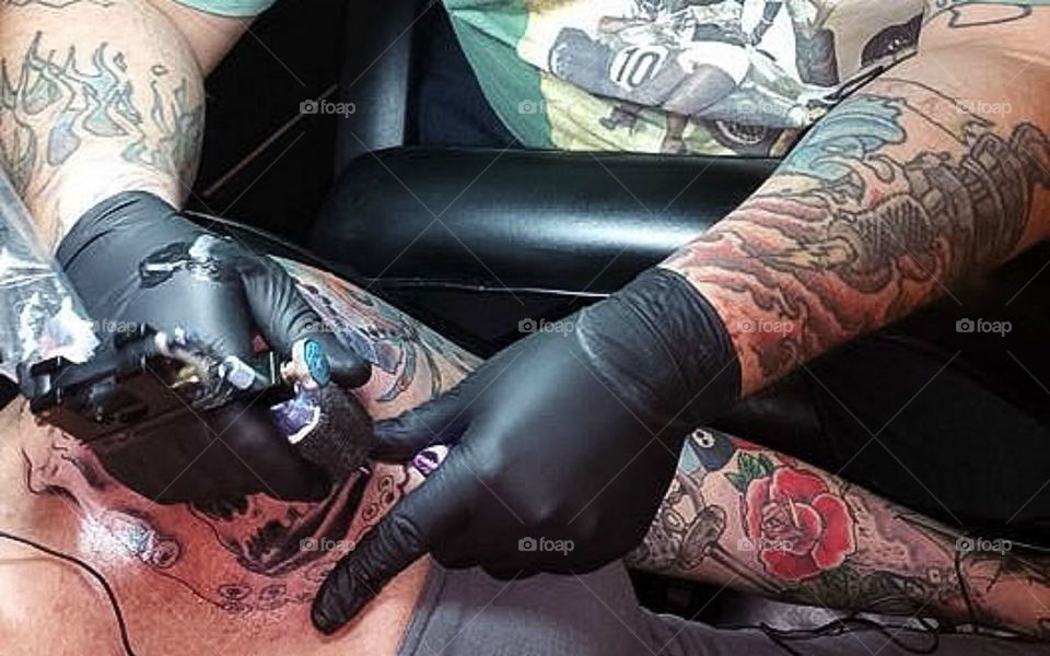 Getting my arm tattooed by artist 