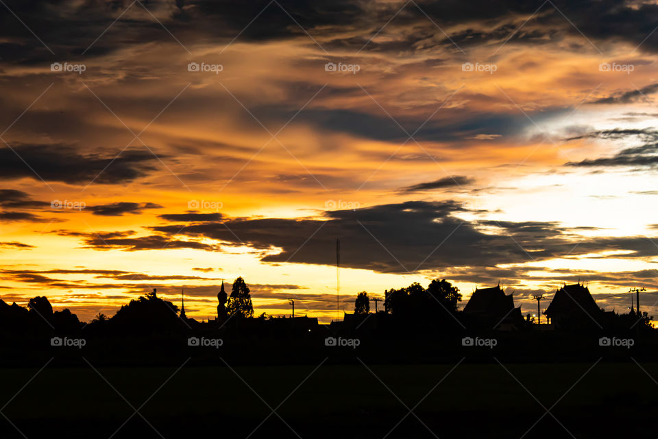 Sunset behind Wat Lad Pha Dook , Temple in Nonthaburi , Thailand.