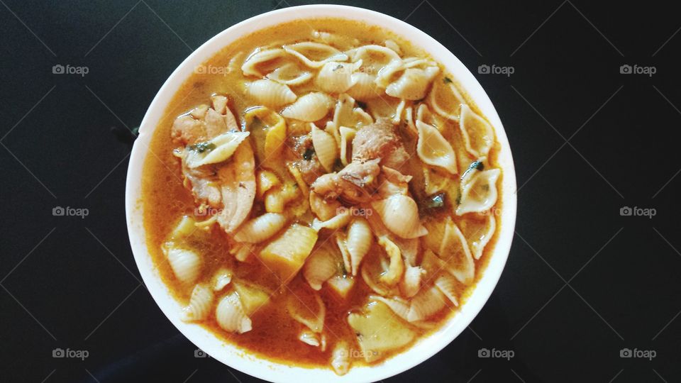SOUP WITH NOODLES AND CHICKEN.