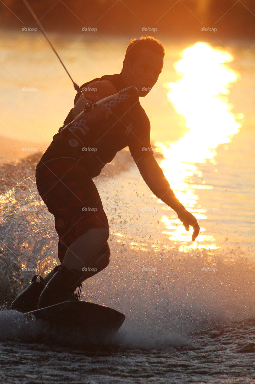 sunset lake sports boy by istvan.jakob