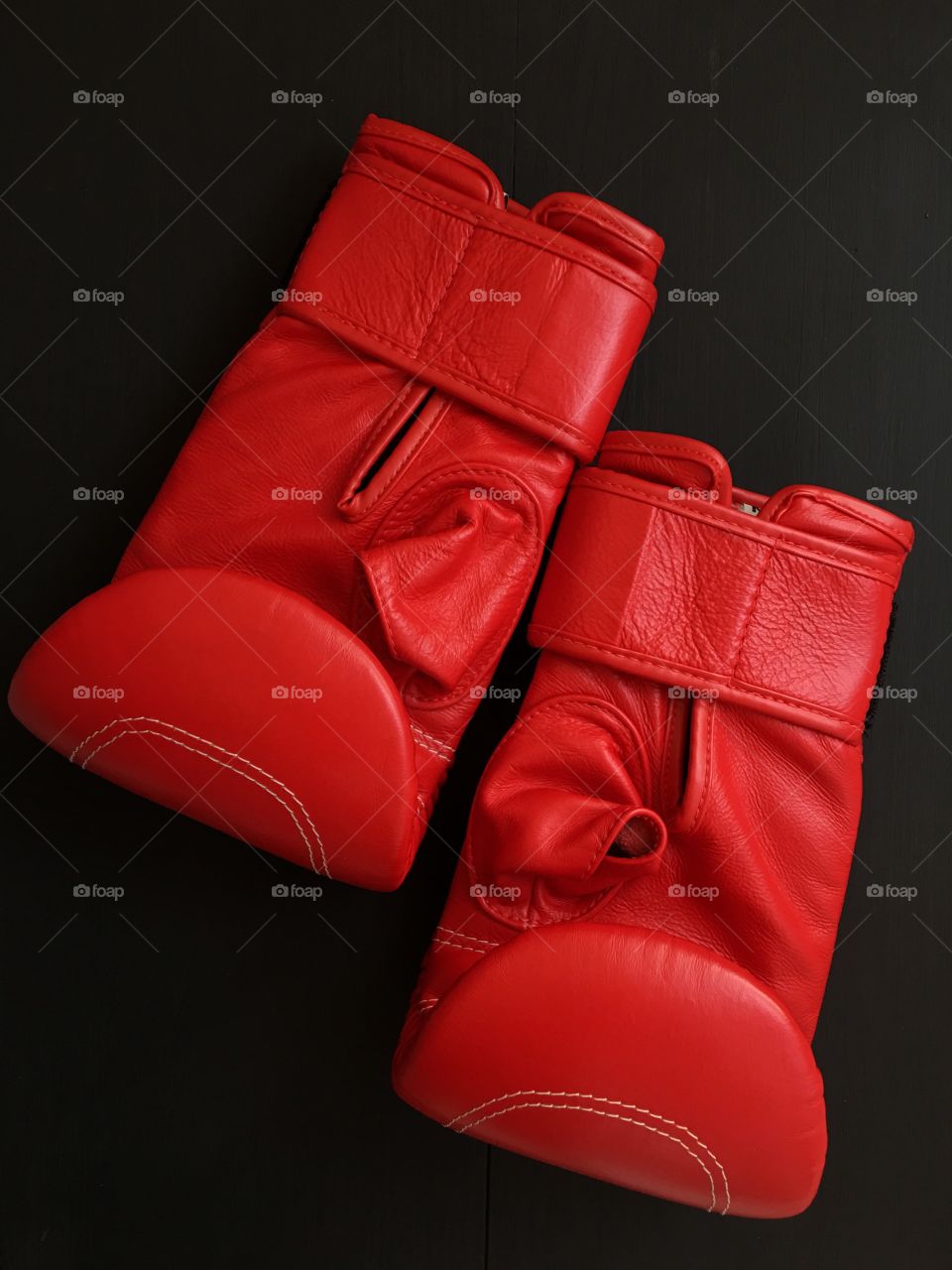 pair of red boxing gloves, top view