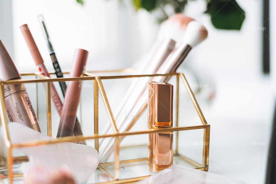 Makeup products on window sill