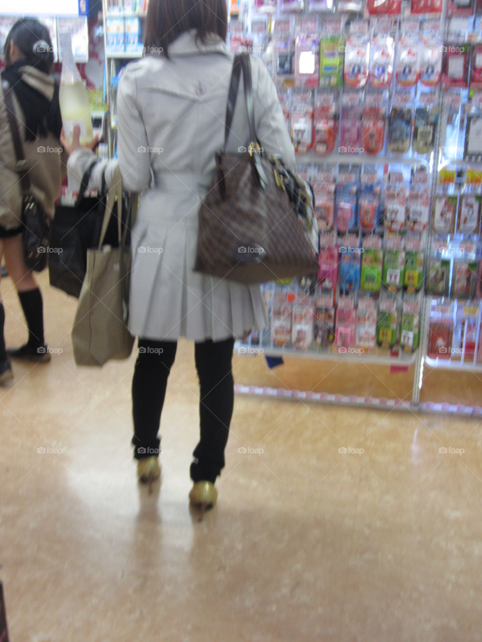 Woman Shopping in Narita Airport Gift Shops, Tokyo, Japan