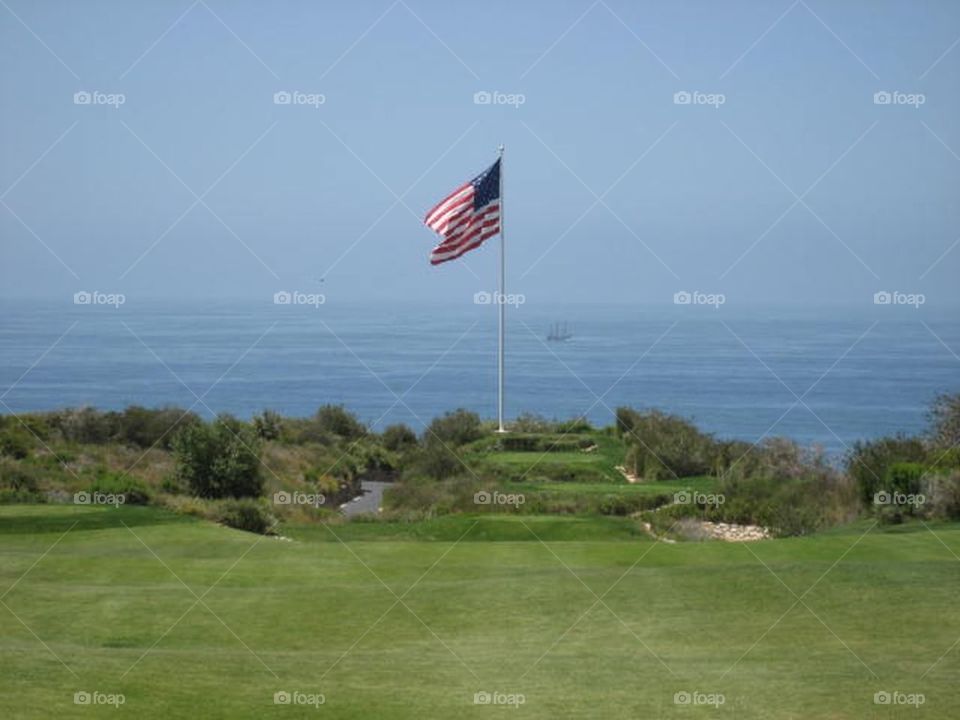 Flag with ocean in background