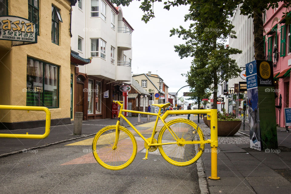 Yellow bike in the street. 