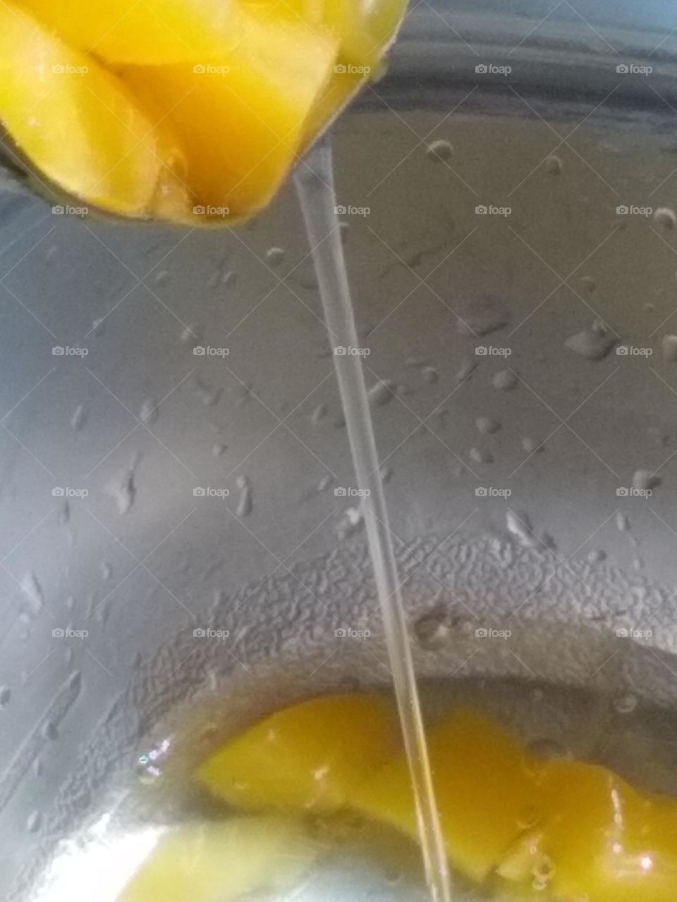 The start of pouring peaches in a bowl 🥣 to eat.