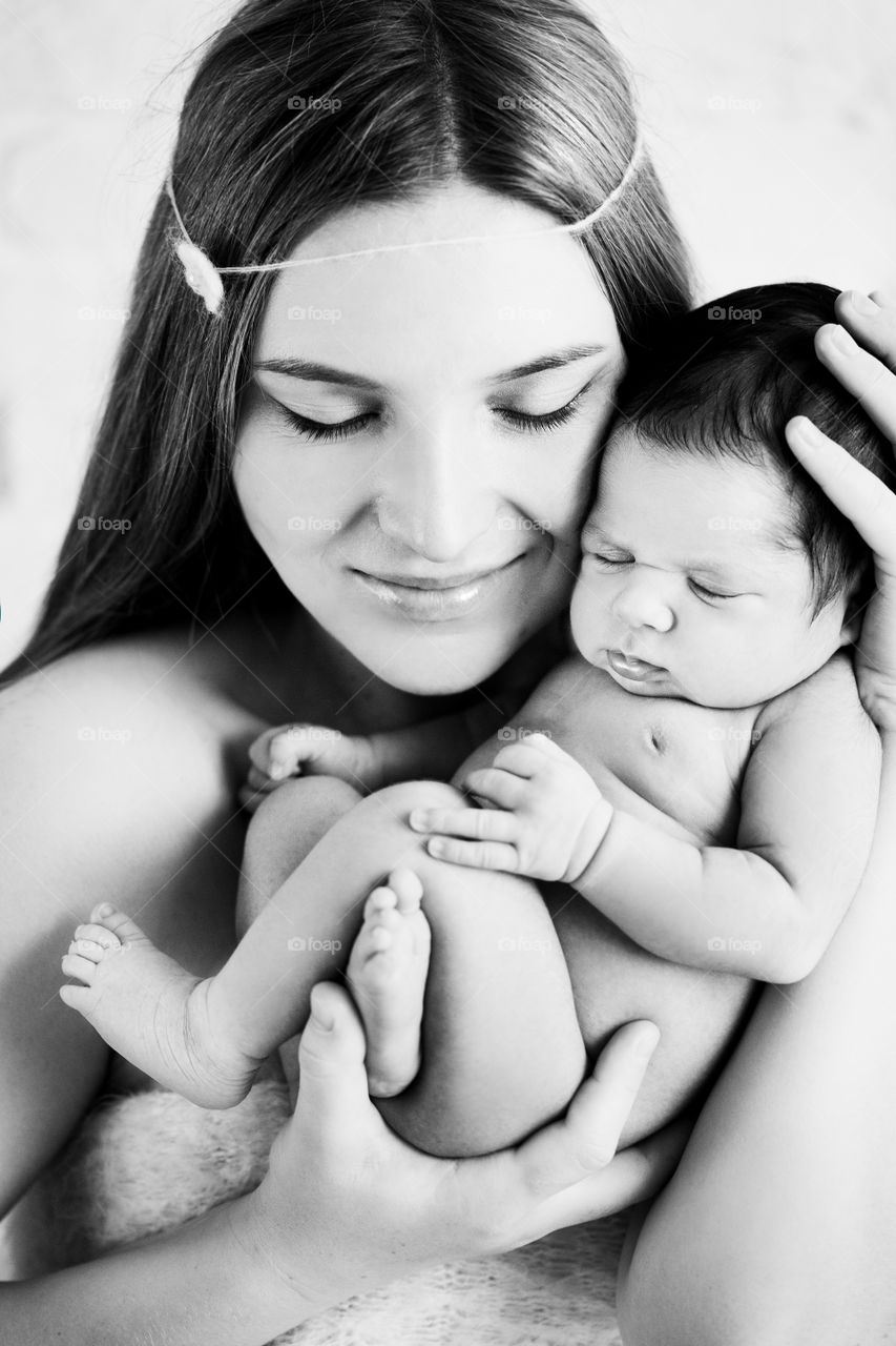 Portrait of woman carrying baby