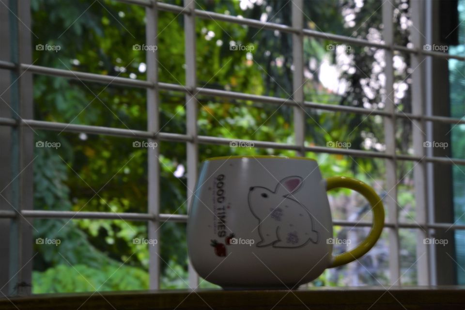 Looking outside with a coffee mug